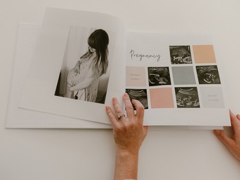 A page in a baby memory book includes pregnancy milestones and a maternity photo.